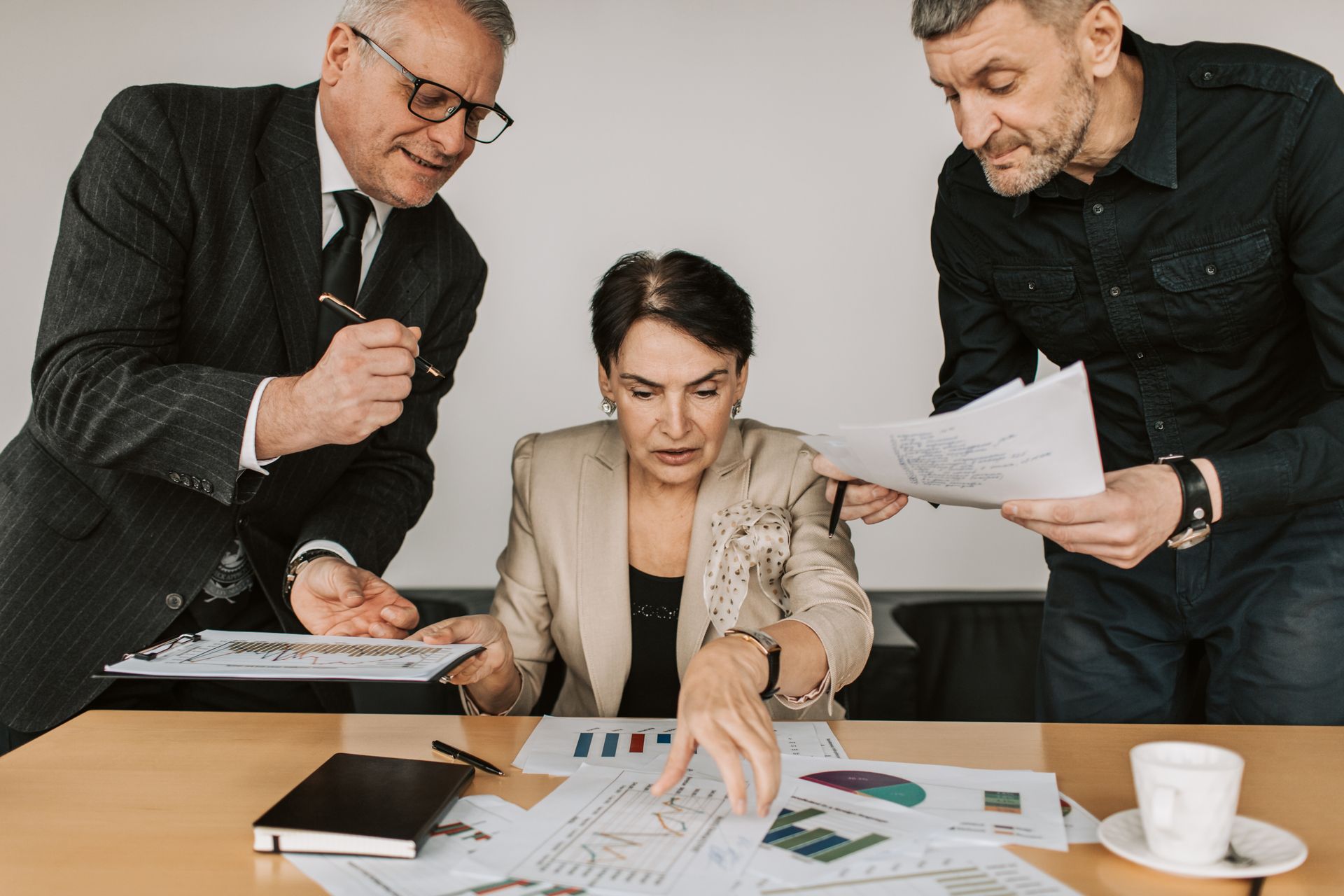 Business team reviewing financial documents in a meeting